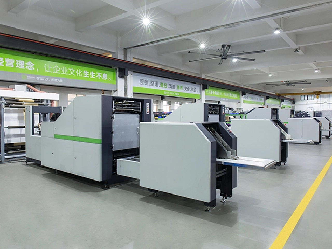 Row of Fully Automatic Paper Bag Machines in a brightly lit factory