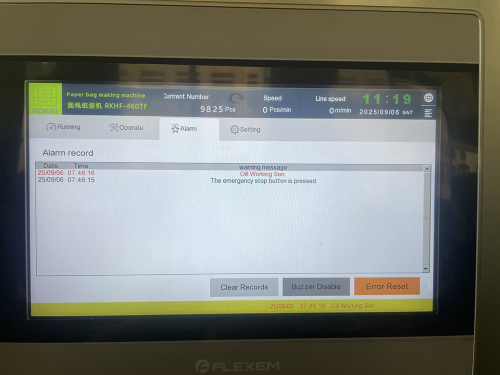 Close-up of the intuitive digital control panel and user interface screen of a paper bag machine.